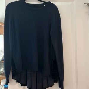 Ellie Tahari Navy Blue Sweater with peplum in back.